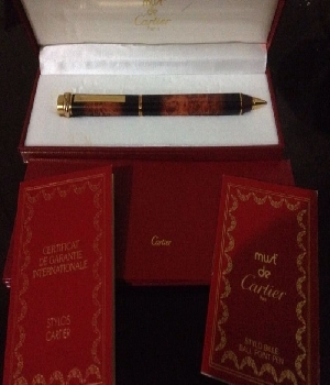 Imagen de Pluma Must de Cartier nueva (chapada en oro) con estuche y certificado.  En numero 0