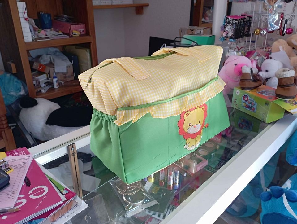 Imagen de Pañalera para bebe leoncito color verde con amarillo numero 0
